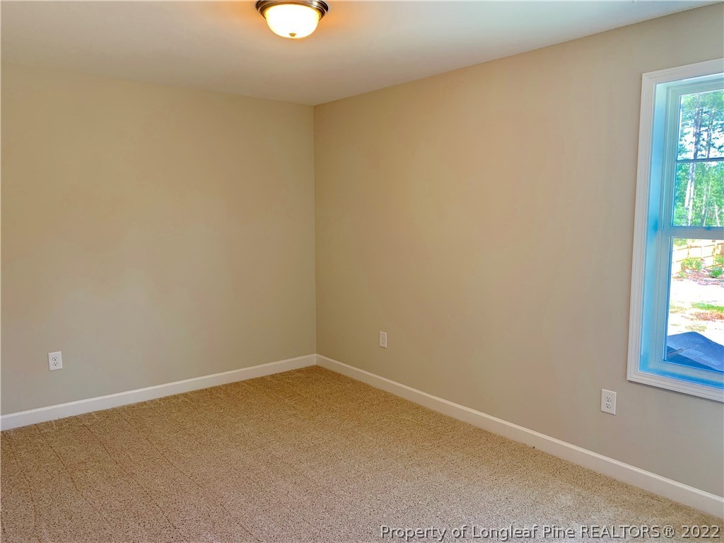939 Montrose Road Raeford, NC 28376 - Photo 19 of 25 an empty room with windows
