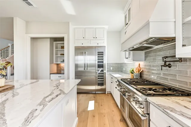 a lobby with furniture and a potted plant