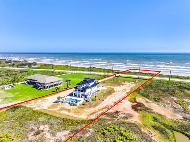 a view of an ocean and a houses