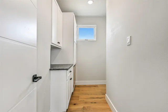 a view of entryway with wooden floor and stairs