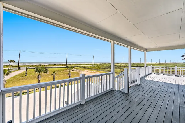 a front view of a house with potted plants