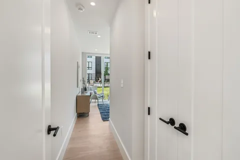 a view of a hallway with closet