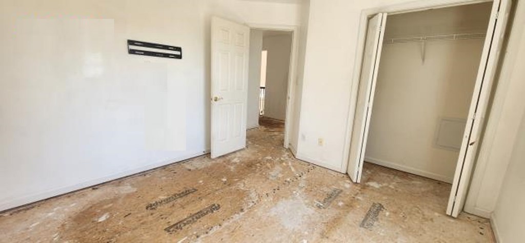 2402 Octopus Road Greenbackville, VA 23356 - Photo 12 of 21 an empty room with a door