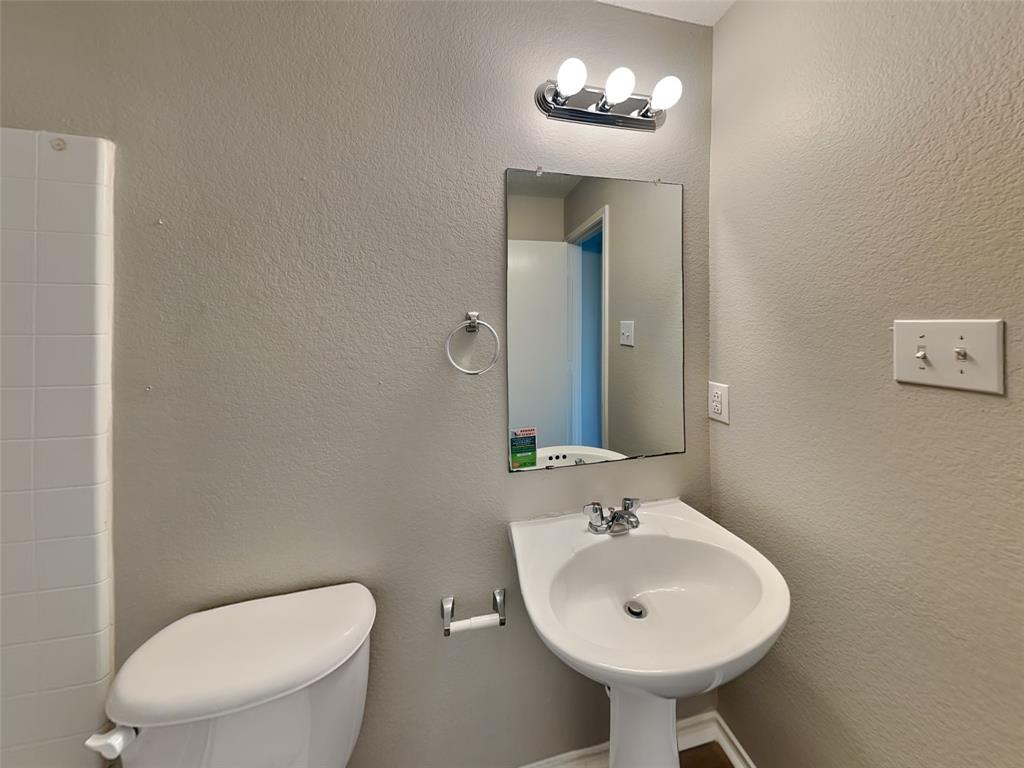 216 Turning Tree Road Wilmer, TX 75172 - Photo 14 of 20 Full bath with a textured wall and a shower