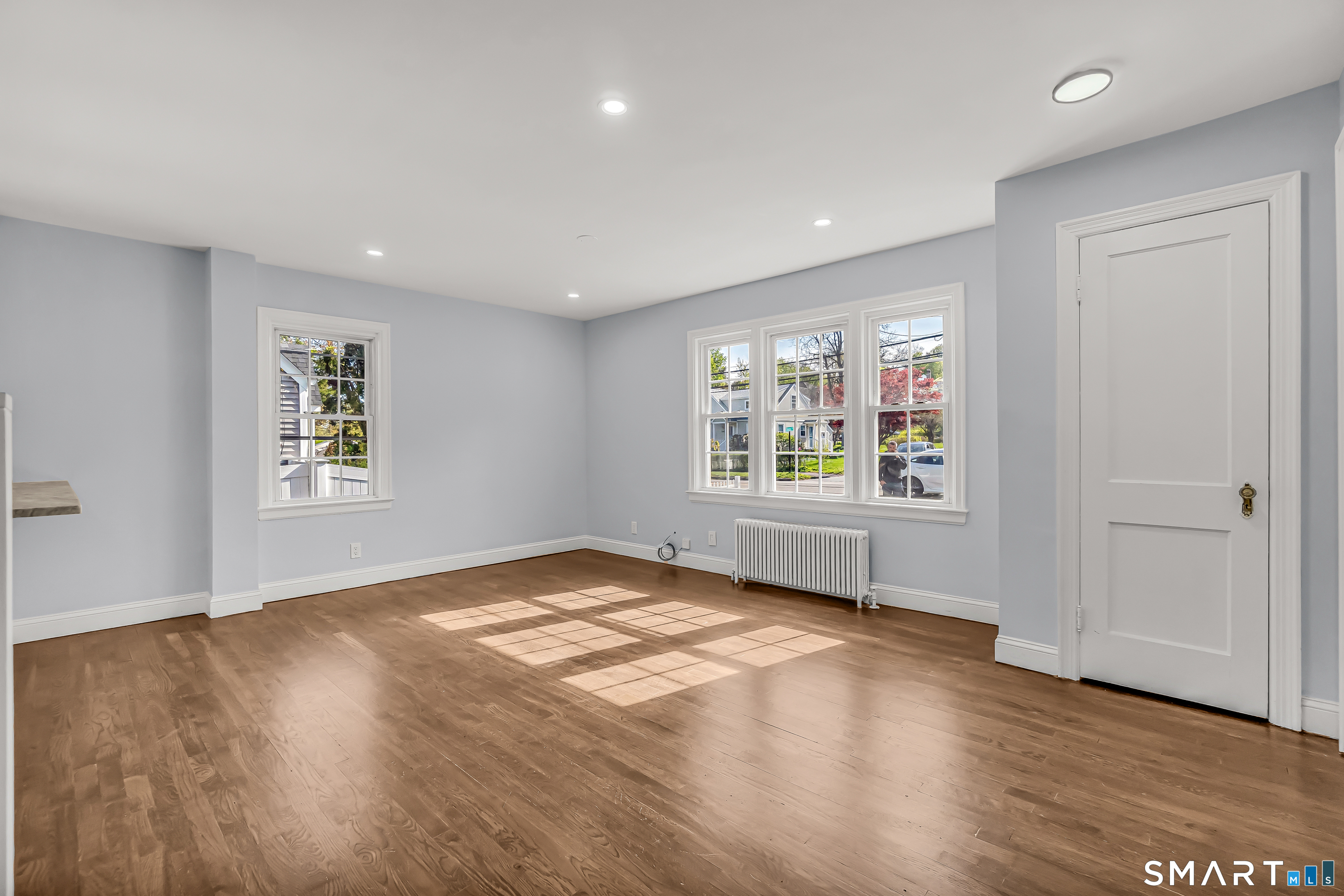 1770 Stratfield Road Fairfield, CT 06825 - Photo 7 of 40 wooden floor in an empty room with a window