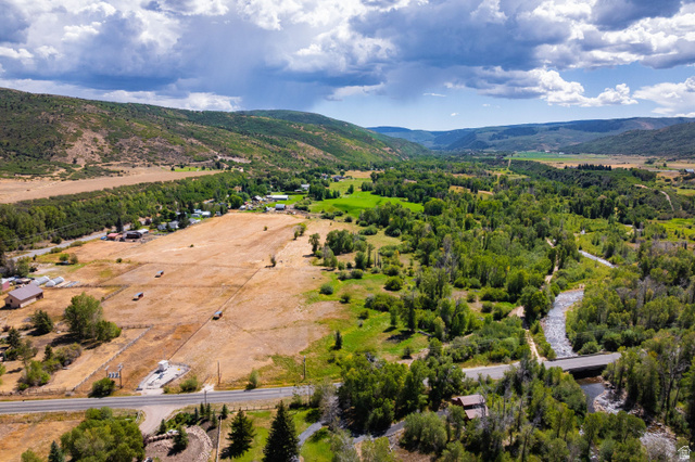 4347 South Bench Creek Road Kamas, UT 84036 - Photo 3 of 30 Expansive property featuring a winding river, dense tree lines, open fields, and mountainous terrain