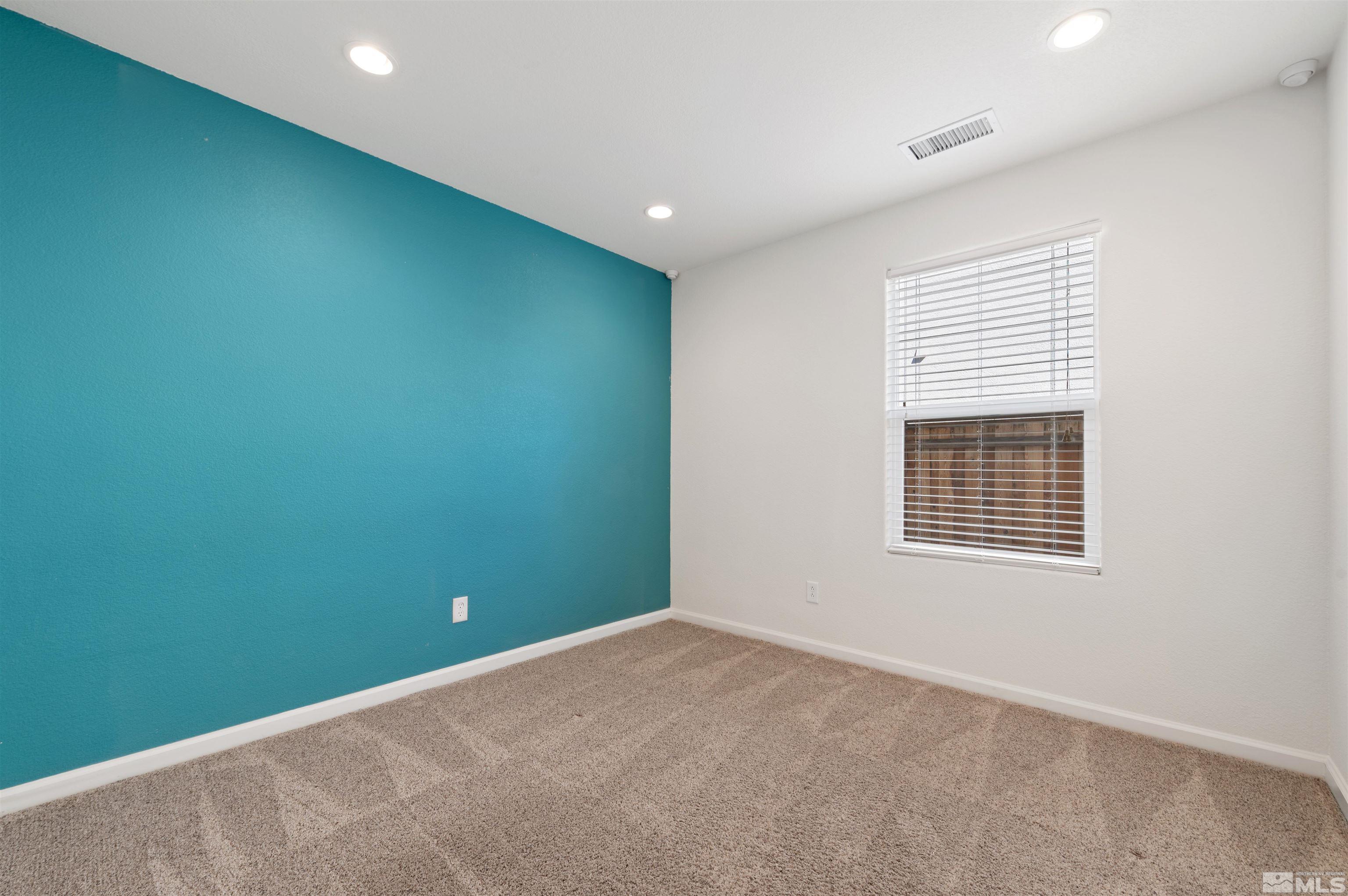11360 Verazae Drive Reno, NV 89521 - Photo 12 of 22 a view of an empty room with a window