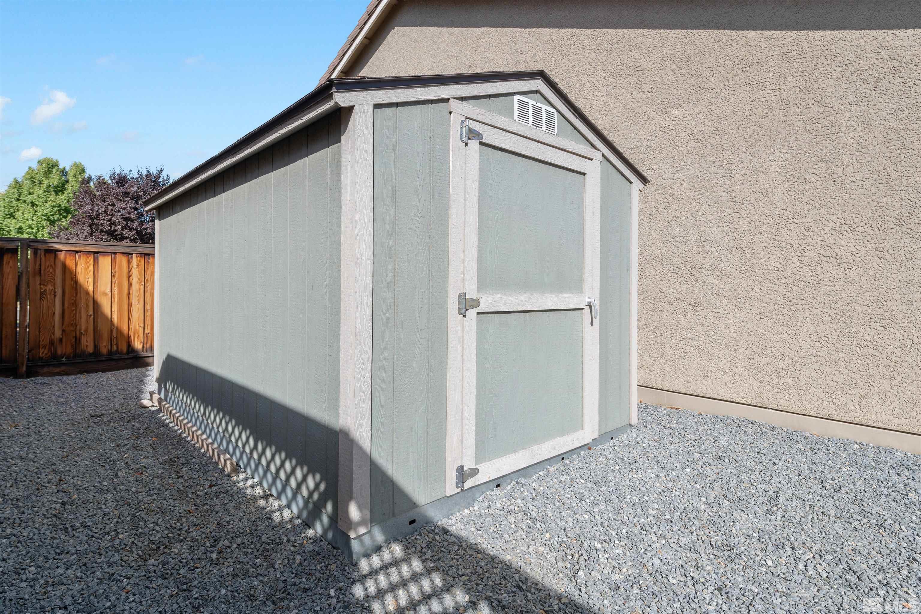 11360 Verazae Drive Reno, NV 89521 - Photo 20 of 22 a view of a house with backyard and wooden fence
