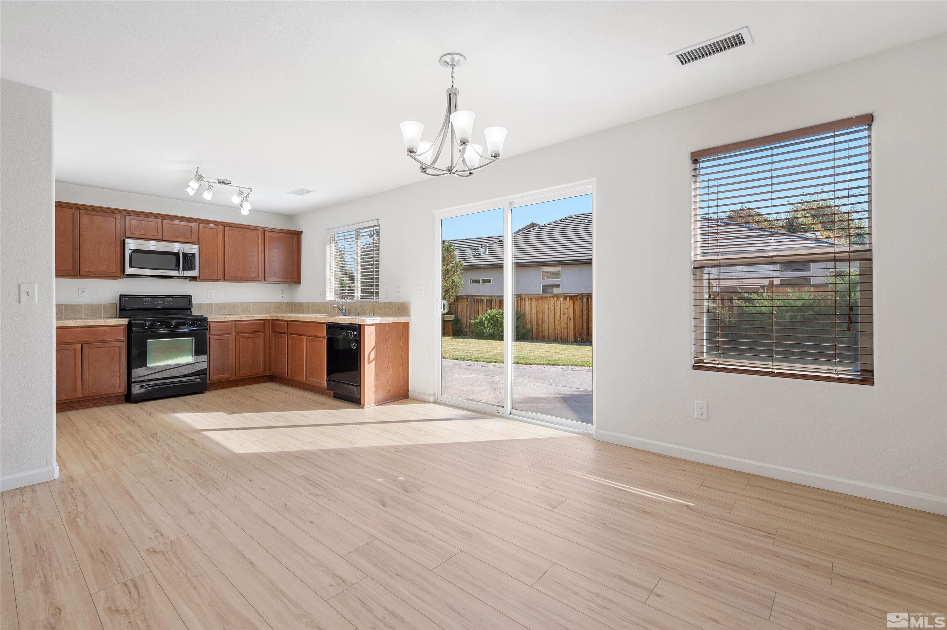 11360 Verazae Drive Reno, NV 89521 - Photo 5 of 22 a view of kitchen with granite countertop cabinets and window