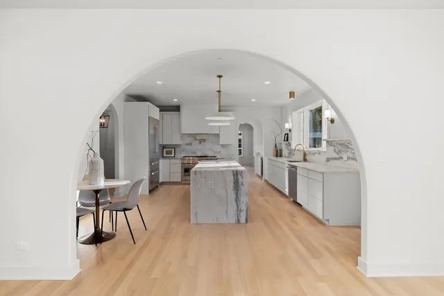 a kitchen with a sink stove and wooden cabinets