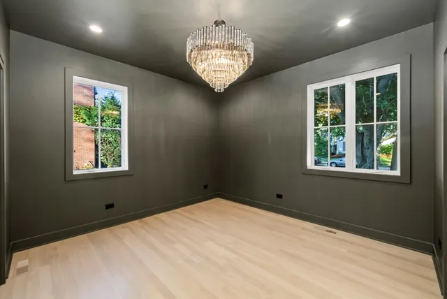 a bathroom with a bathtub a sink a mirror and a shower