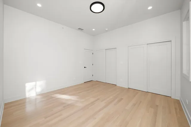 wooden floor with a rug and a living room view