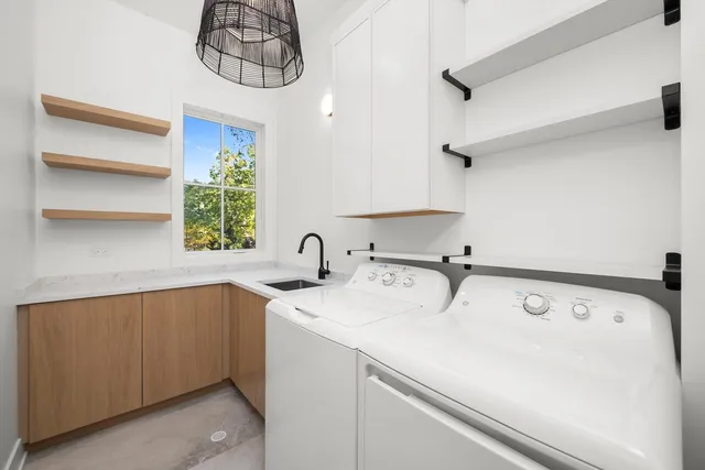 an aerial view of a houses with yard