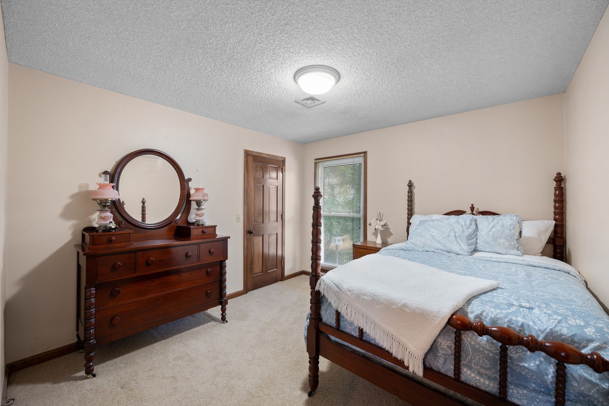 154 B Spring Valley Road Nashville, TN 37214 - Photo 20 of 29 a bedroom with a bed and a dresser