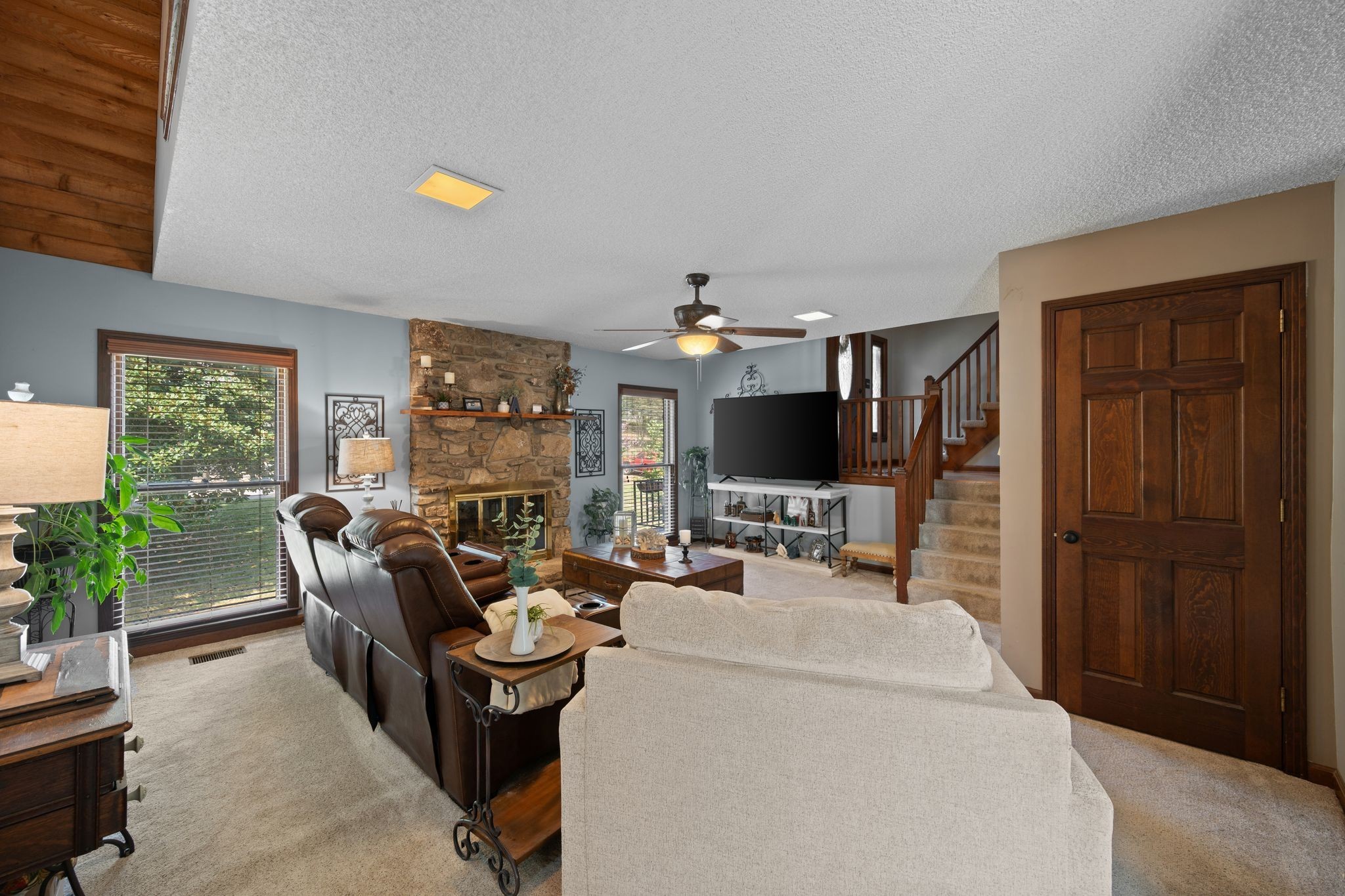 154 B Spring Valley Road Nashville, TN 37214 - Photo 6 of 29 a living room with furniture a flat screen tv and a fireplace