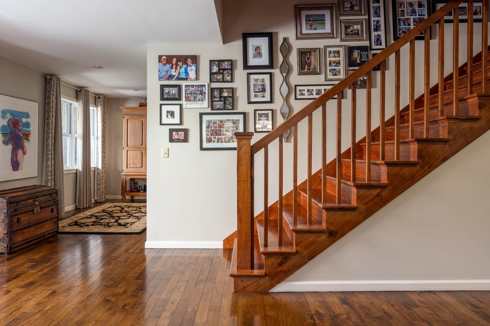 1098 Fred Gibbs Road White Bluff, TN 37187 - Photo 18 of 72 a view of staircase with wooden floor and lots of frames on wall