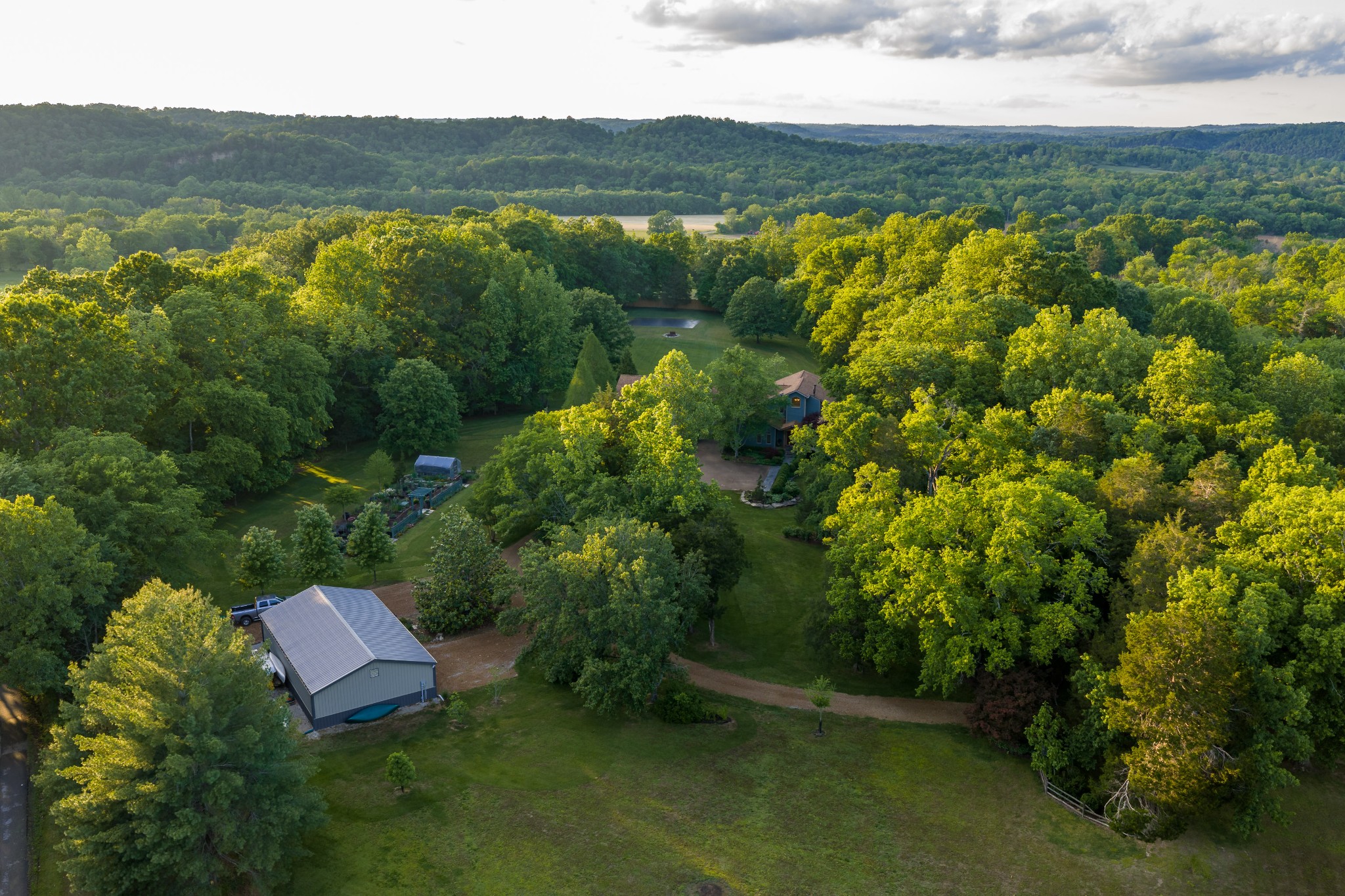 1098 Fred Gibbs Road White Bluff, TN 37187 - Photo 55 of 72 a view of a lake with a mountain in the background