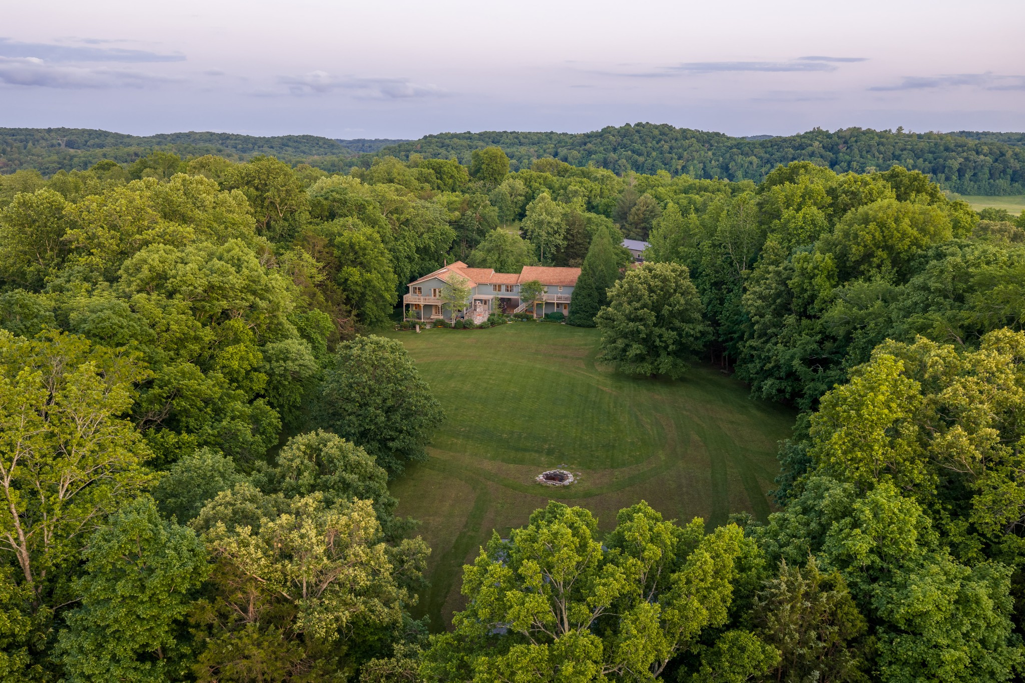 1098 Fred Gibbs Road White Bluff, TN 37187 - Photo 69 of 72 a view of a lake with a house in the background