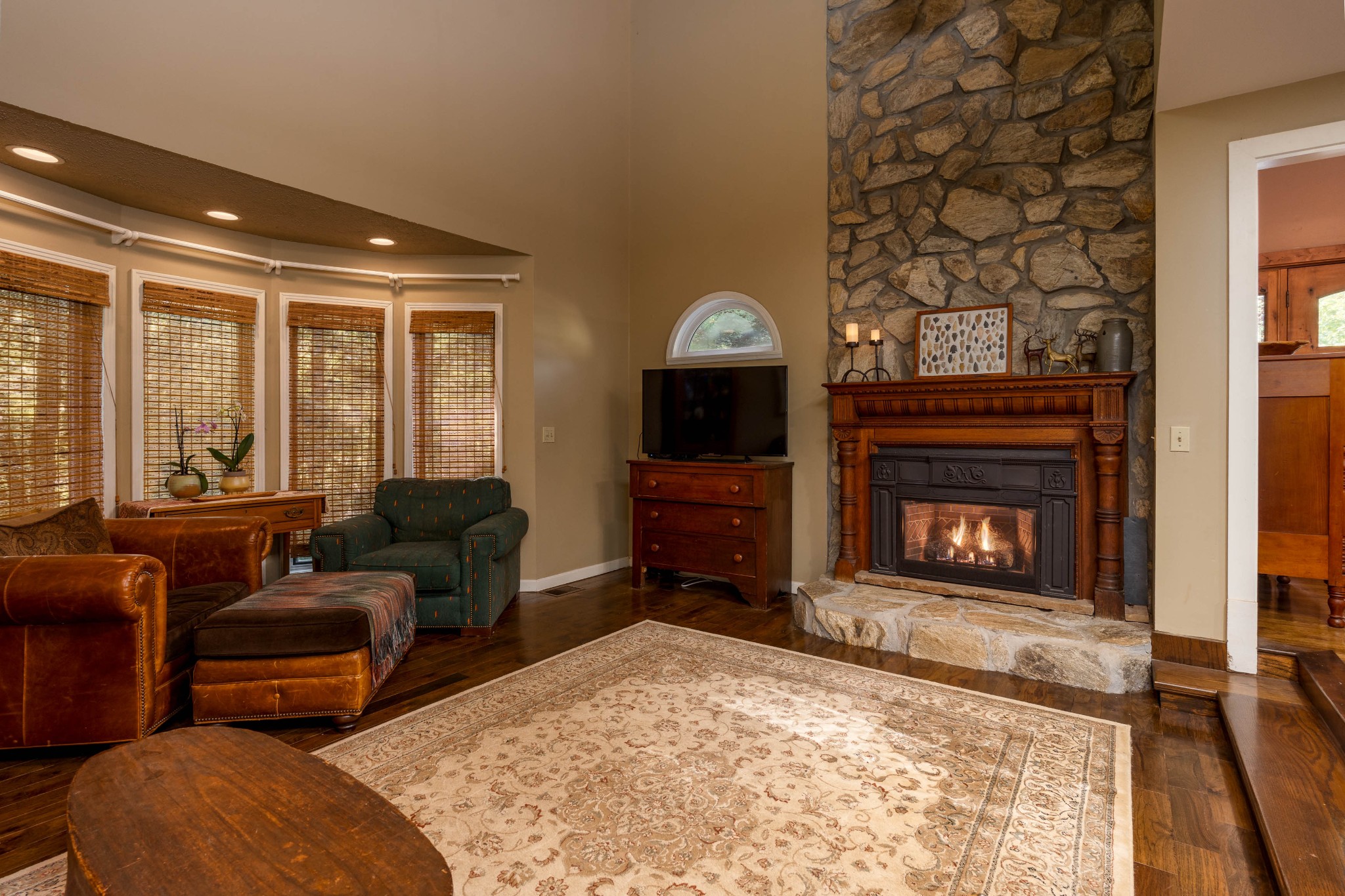 1098 Fred Gibbs Road White Bluff, TN 37187 - Photo 8 of 72 a living room with furniture a flat screen tv and a fireplace