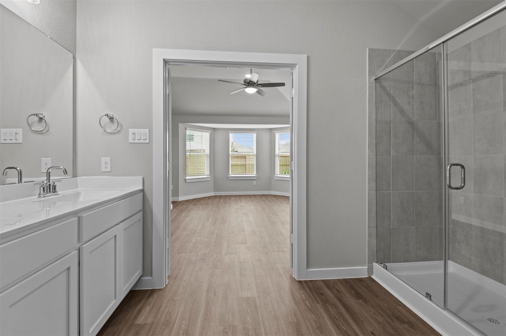 3003 Middleton Drive Rosenberg, TX 77471 - Photo 8 of 18 a bathroom with a sink a large mirror and shower