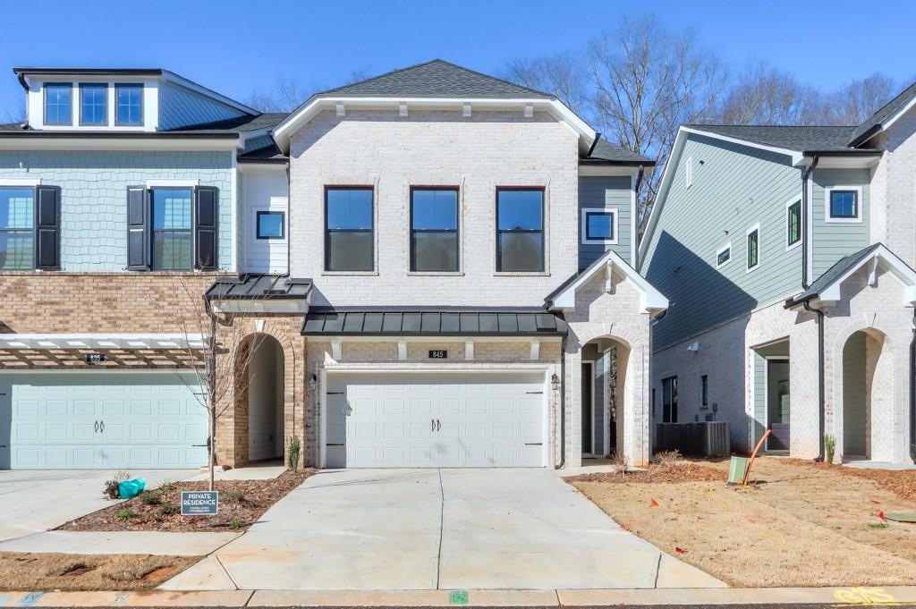 a front view of a house with a garage