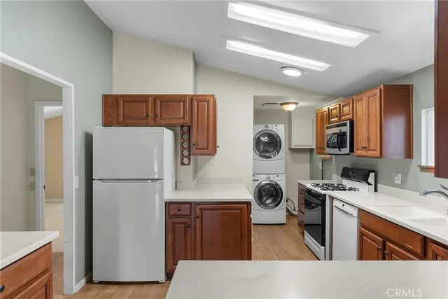 a kitchen with a refrigerator a sink and dishwasher