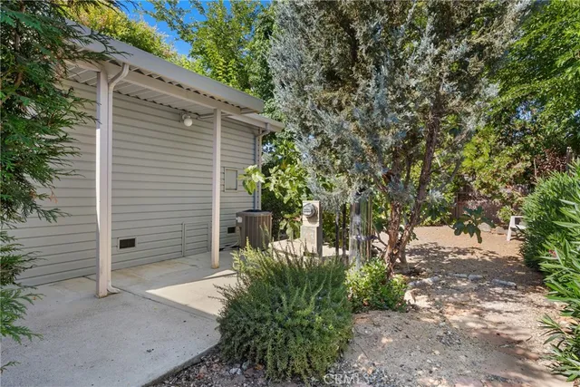 a yellow house with trees in front of it