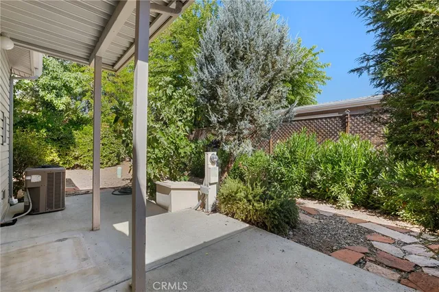 a view of a patio with plants and garden