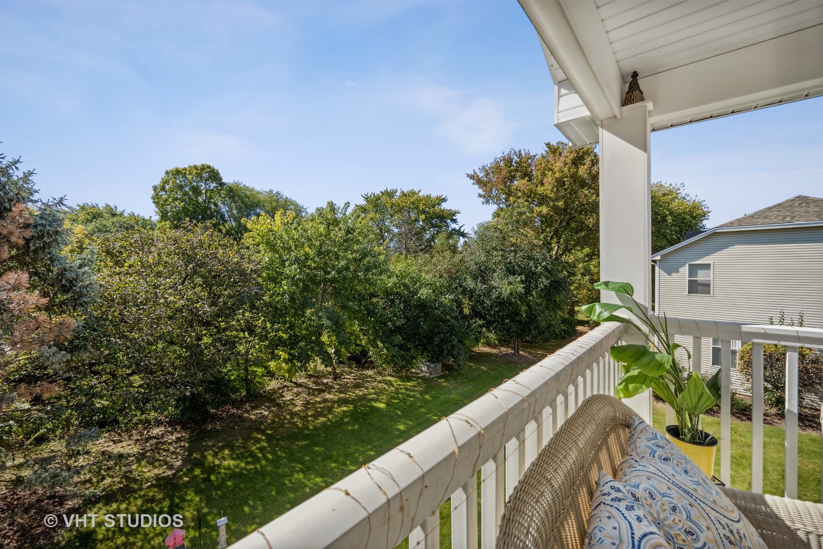 318 Ridge Road, Unit 318 North Aurora, IL 60542 - Photo 13 of 13 a balcony with trees in front of it