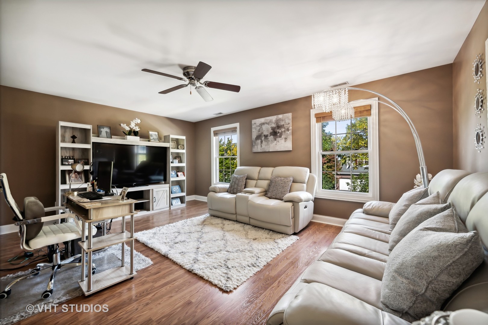 318 Ridge Road, Unit 318 North Aurora, IL 60542 - Photo 2 of 13 a living room with furniture and a flat screen tv