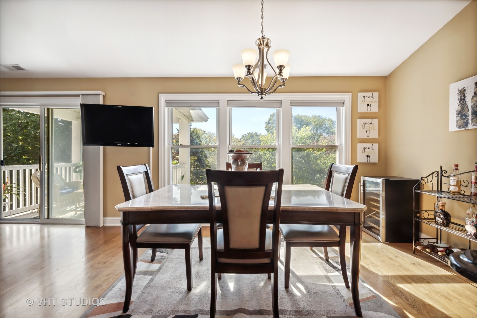 318 Ridge Road, Unit 318 North Aurora, IL 60542 - Photo 5 of 13 a view of a dining room with furniture window and wooden floor