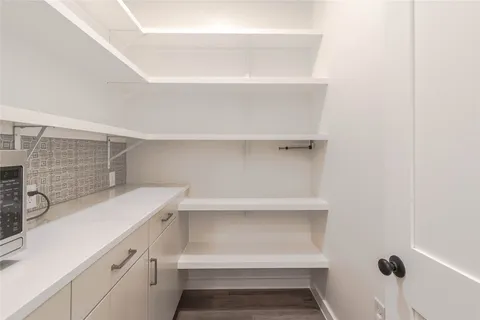 a view of storage and utility room with washer and dryer