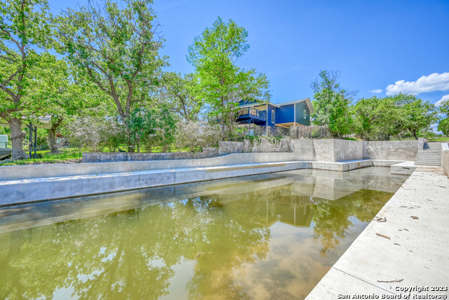 101 Princess Terrace Sunrise Beach, TX 78643 - Photo 11 of 17 a view of a swimming pool with a yard
