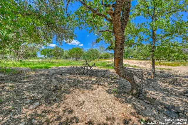 a view of outdoor space with deck and yard