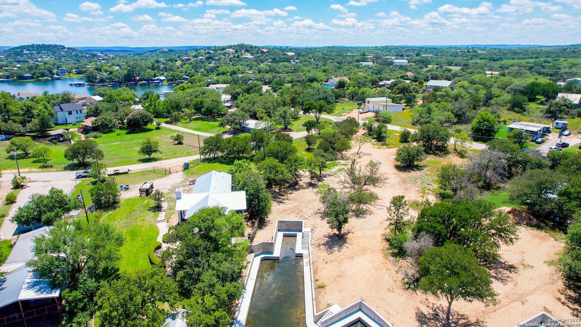 101 Princess Terrace Sunrise Beach, TX 78643 - Photo 17 of 17 an aerial view of residential houses with outdoor space and trees