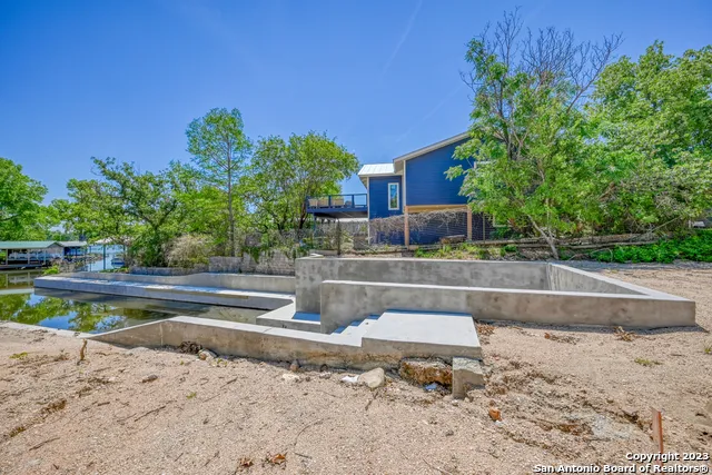 a view of a swimming pool with a patio