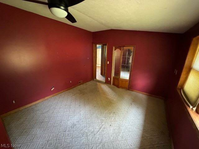 3225 Call Road Perry, OH 44081 - Photo 14 of 14 Unfurnished room featuring carpet flooring, lofted ceiling, and ceiling fan
