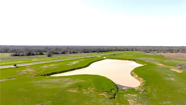 a view of a lake with a big yard