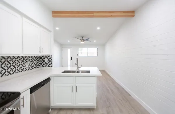 a bathroom with a sink a vanity and mirror