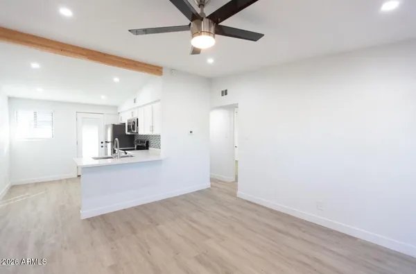 a view of kitchen with wooden floor