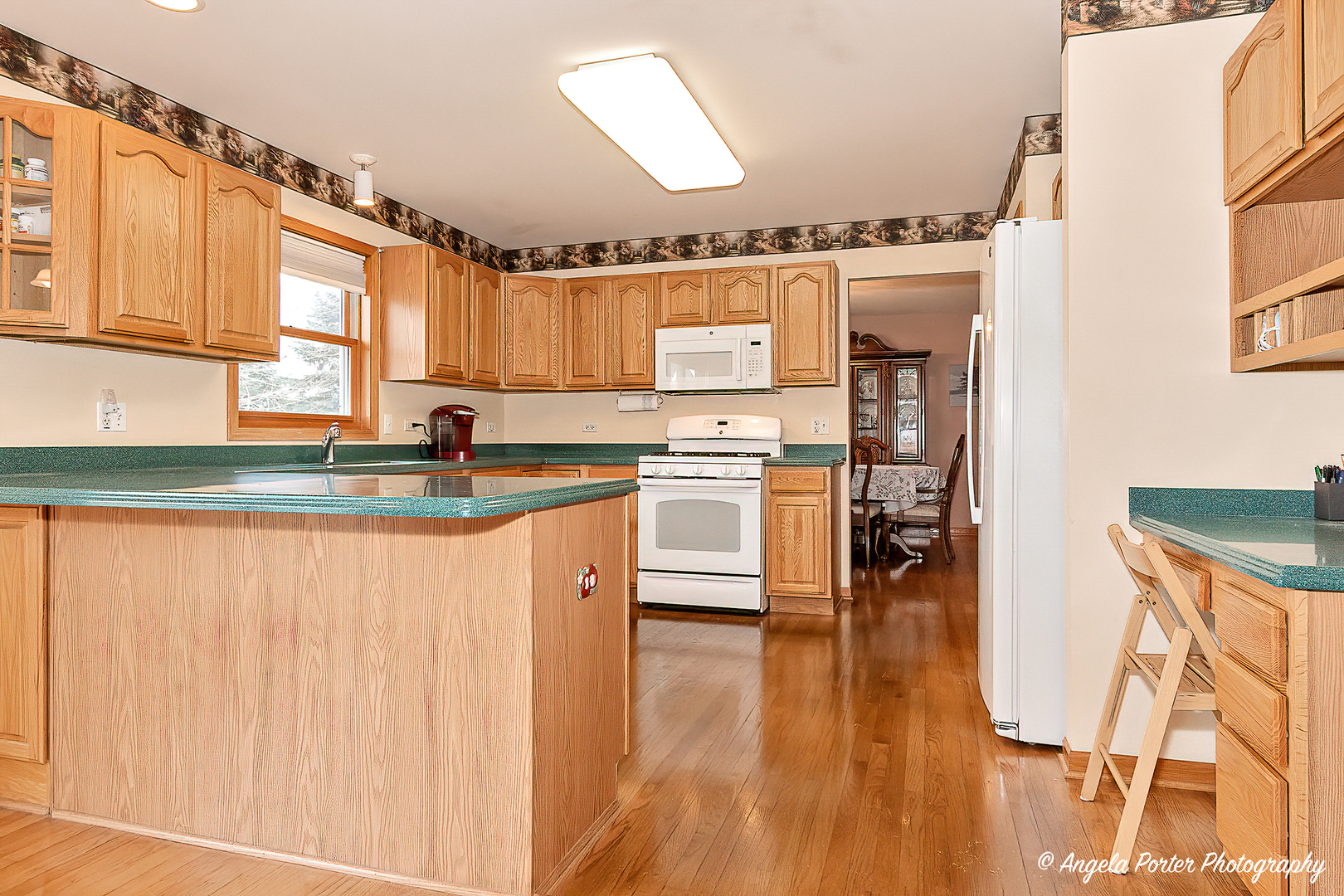 814 Suzanne Lane Spring Grove, IL 60081 - Photo 5 of 45 a kitchen with stainless steel appliances granite countertop a stove a sink and a refrigerator