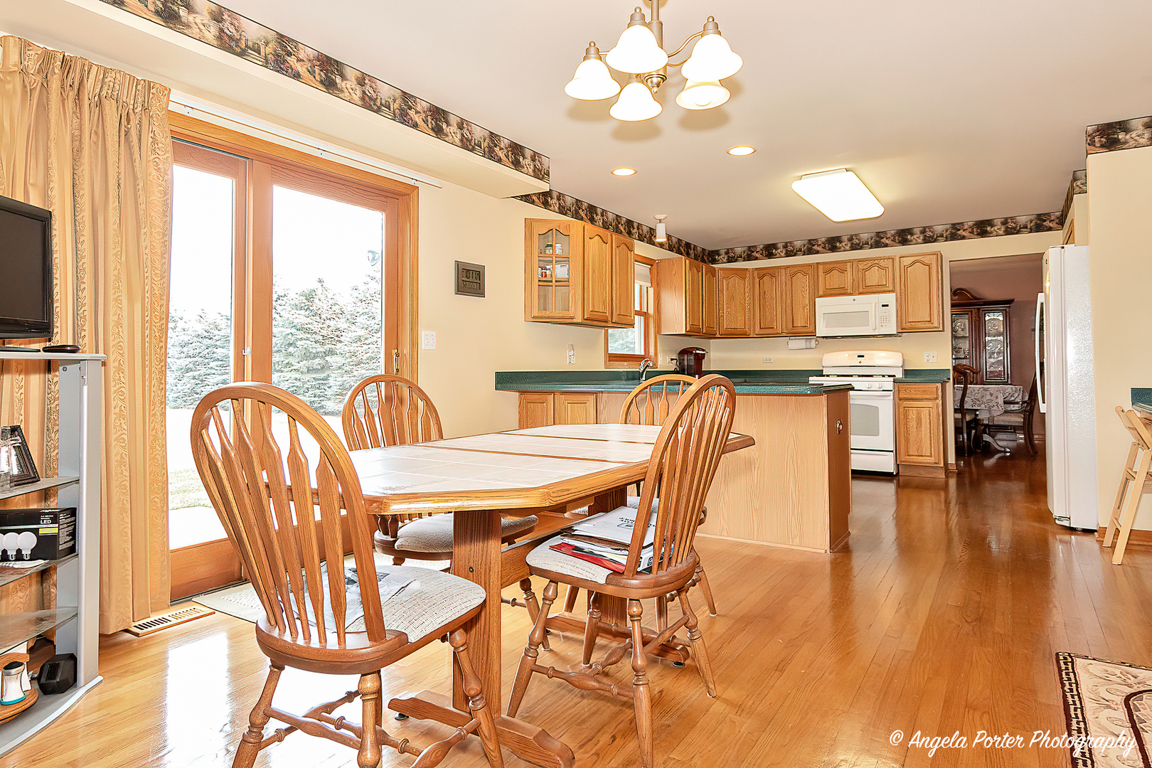 814 Suzanne Lane Spring Grove, IL 60081 - Photo 10 of 45 a view of a dining room with furniture window and wooden floor