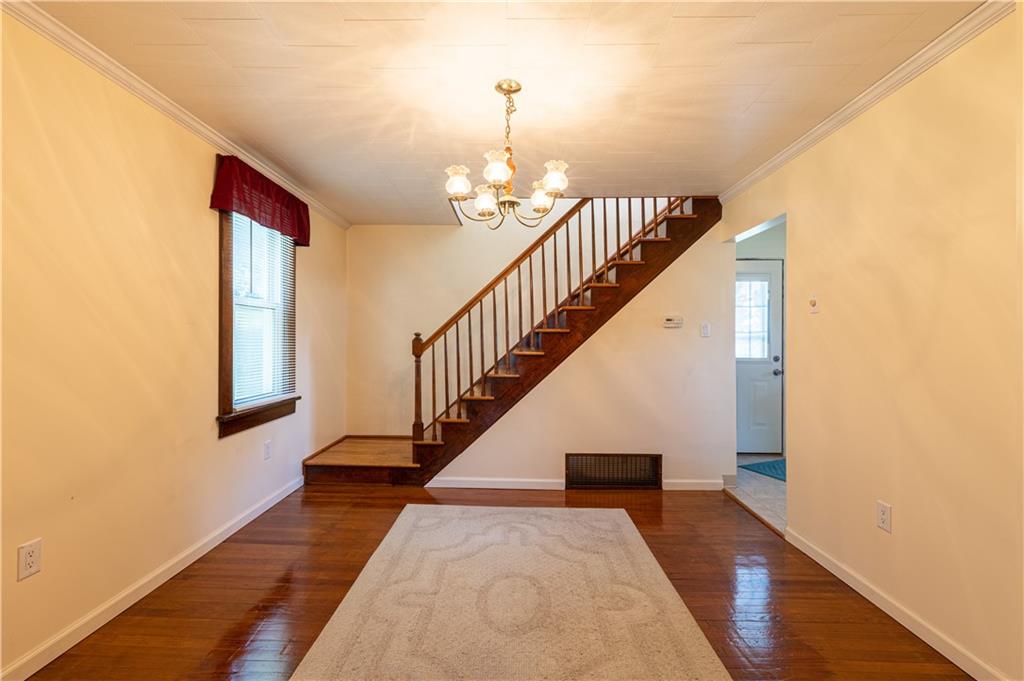 216 Carson Road Dawson, PA 15428 - Photo 7 of 25 a view of entryway and hall with wooden floor