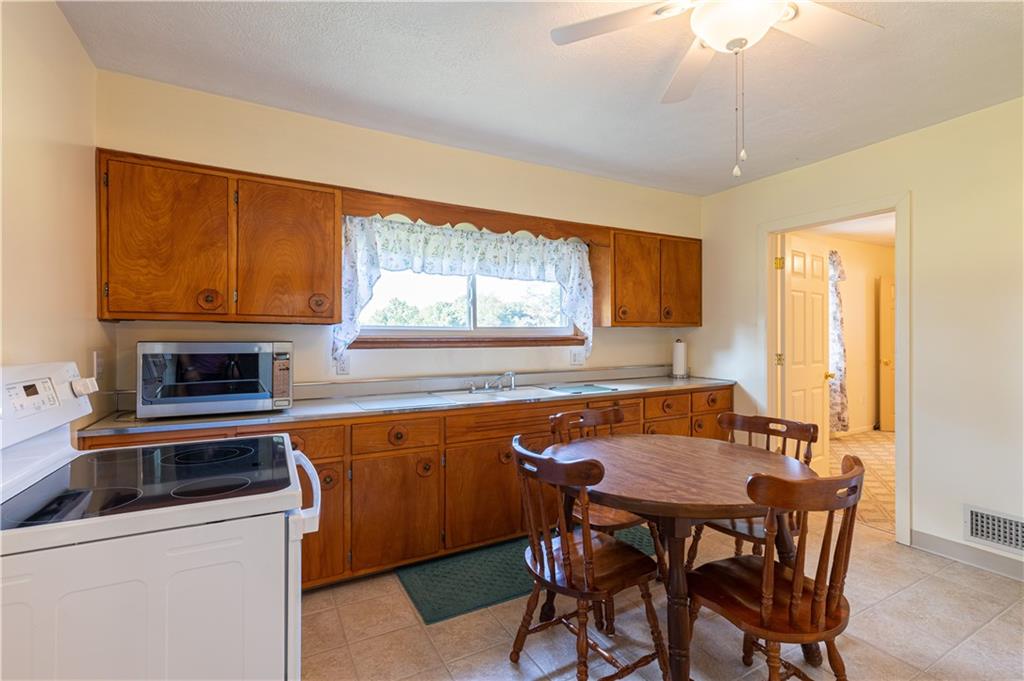 216 Carson Road Dawson, PA 15428 - Photo 9 of 25 a dining table with chairs and window