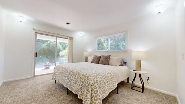 a bedroom with a bed and a couch