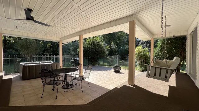 a outdoor space with patio the couches and dinning table and chairs