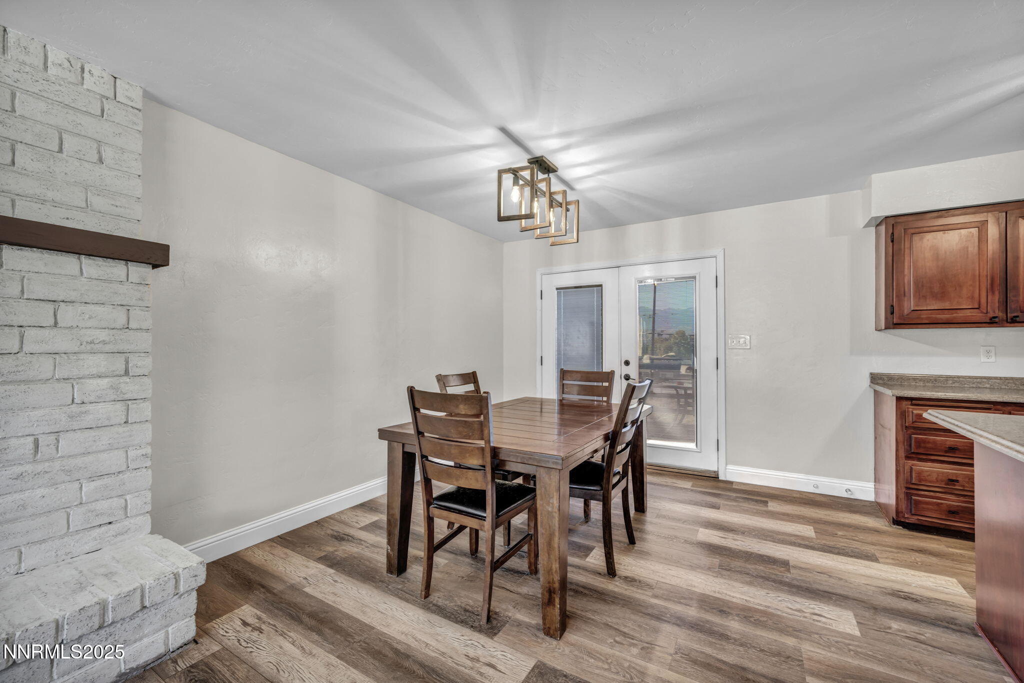 14595 Chamy Drive Reno, NV 89521 - Photo 17 of 66 a view of a dining room with furniture and wooden floor