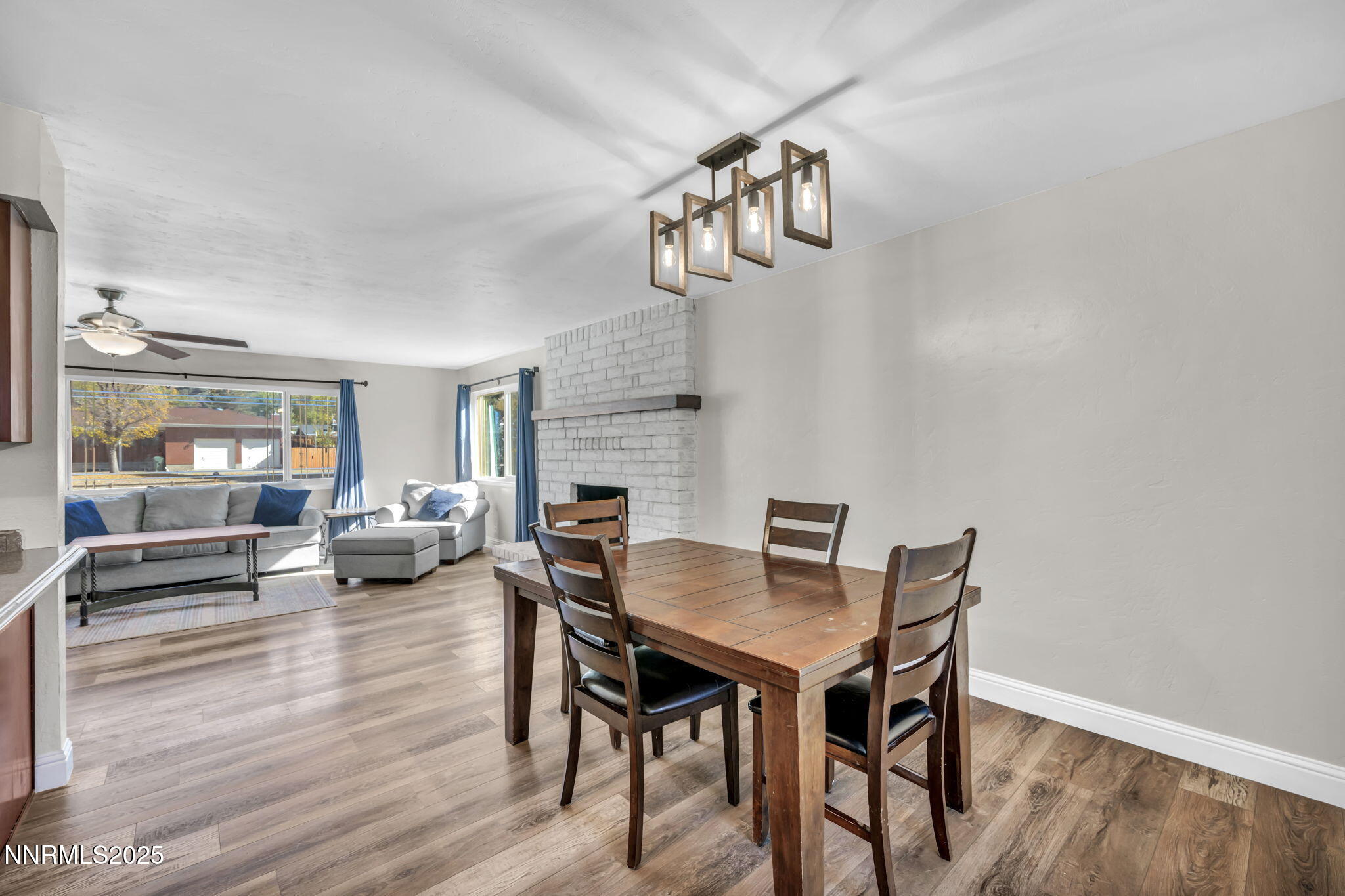 14595 Chamy Drive Reno, NV 89521 - Photo 20 of 66 a view of a dining room with furniture wooden floor and a chandelier
