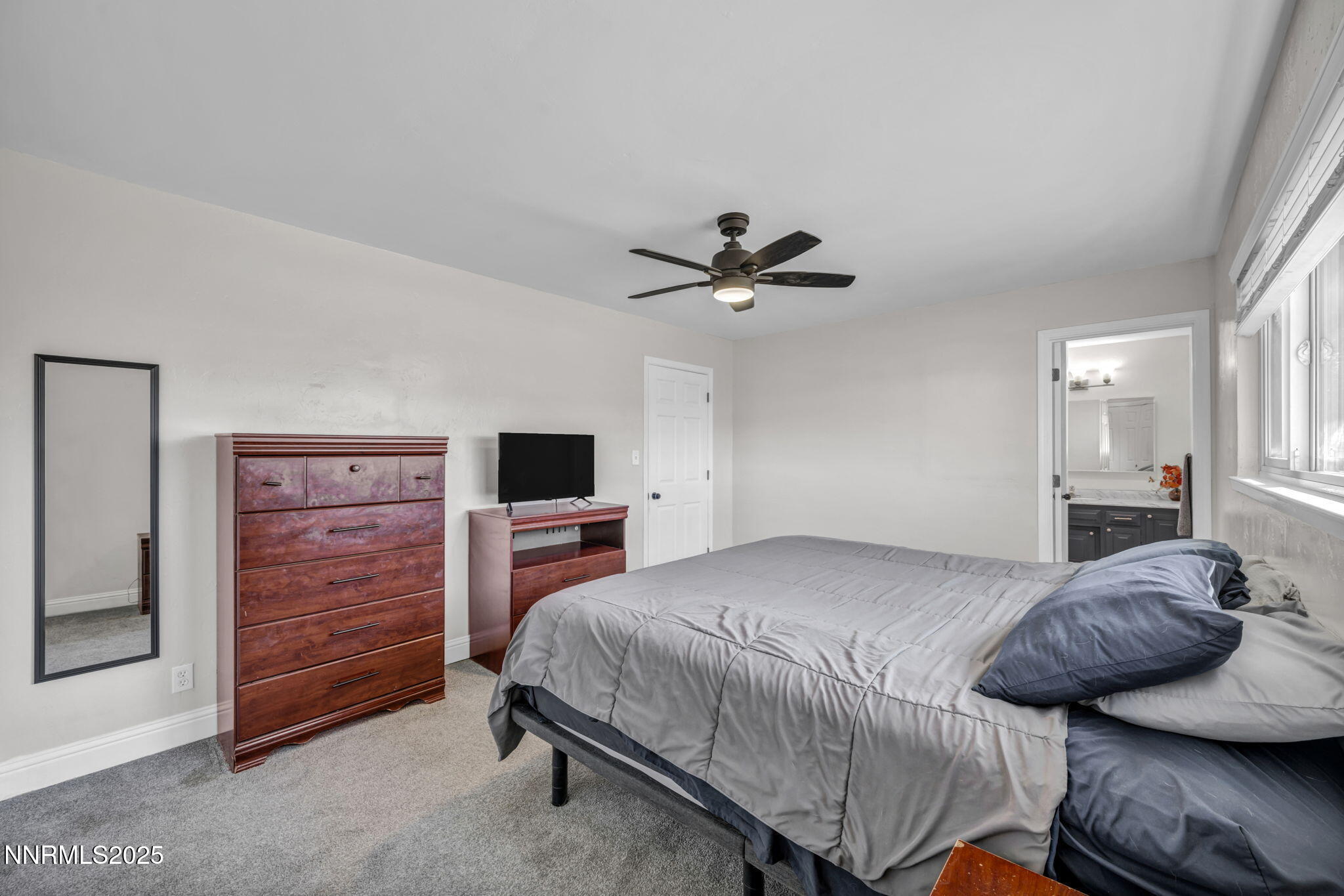 14595 Chamy Drive Reno, NV 89521 - Photo 34 of 66 a bedroom with a bed and furniture