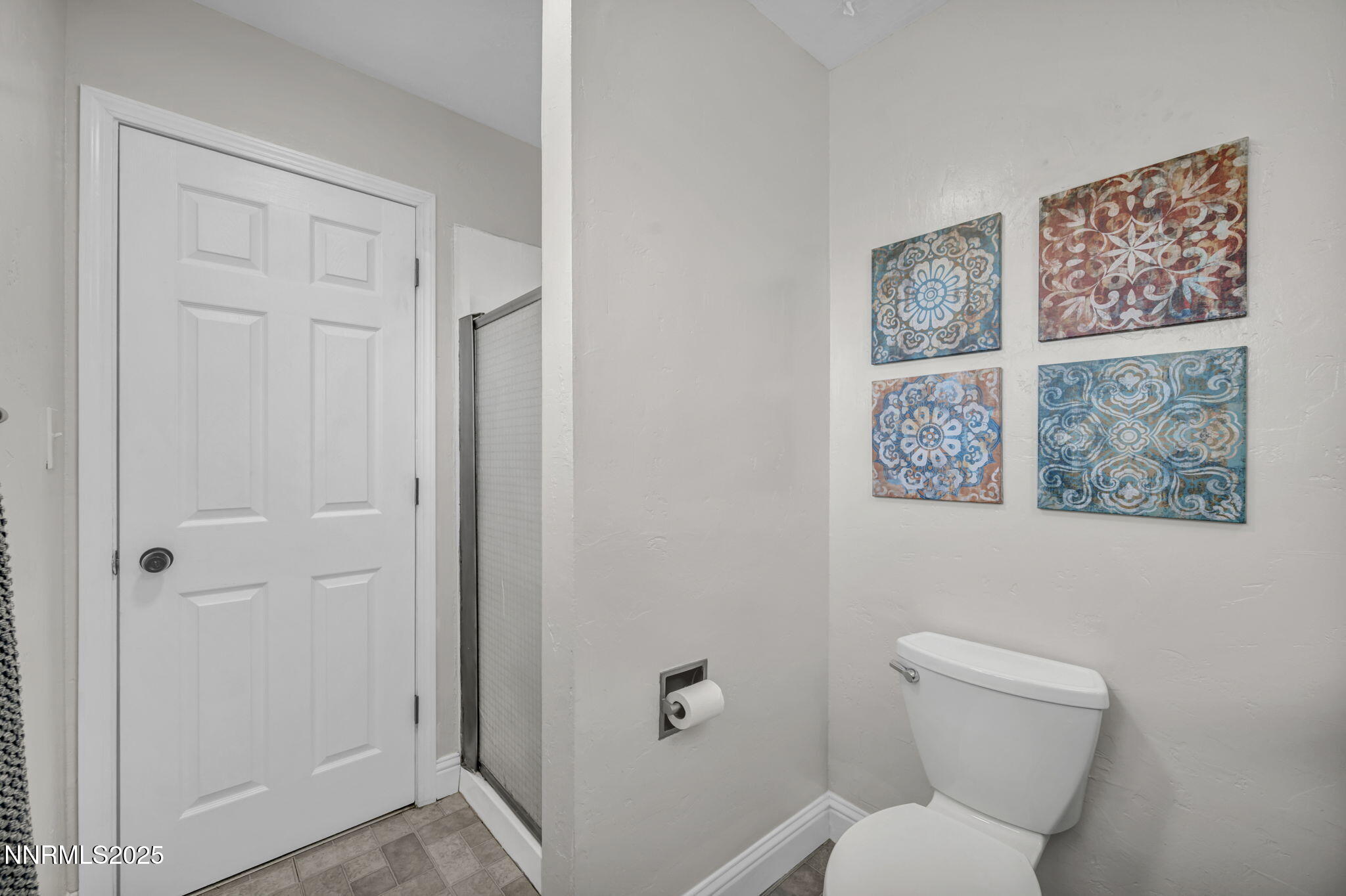 14595 Chamy Drive Reno, NV 89521 - Photo 36 of 66 a white toilet sitting next to a bathroom sink